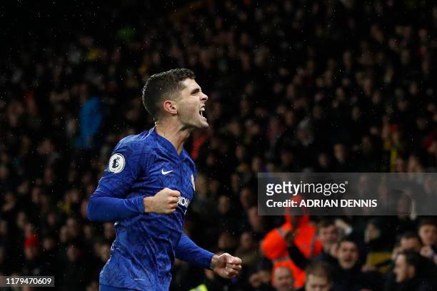 Chelsea's US midfielder Christian Pulisic celebrates scoring his team's second goal during the English Premier League football match between Watford...
