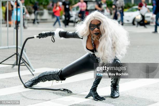 Cosplayer dressed as Black Cat from "Spider-Man" and the Marvel Universe arrives at New York Comic Con on October 05, 2019 in New York City.