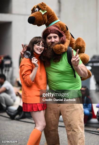 Cosplayers pose as Velma, Shaggy and Scooby during New York Comic Con 2019 on October 06, 2019 in New York City.