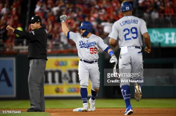 Russell Martin of the Los Angeles Dodgers celebrates his two run RBI double in the sixth inning of Game 3 of the NLDS against the Washington...