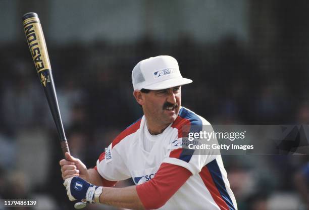 England cricket batsman Graham Gooch tries his hand at batting in Baseball during an event at the Oval Cricket ground on September 25, 1988 in...