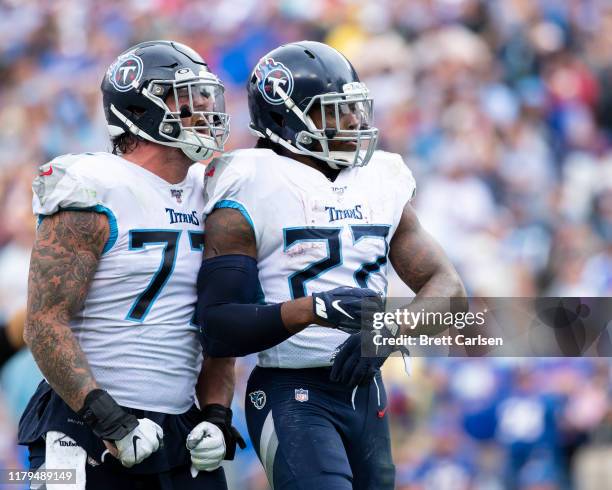 Derrick Henry of the Tennessee Titans celebrates a third quarter touchdown with Taylor Lewan against the Buffalo Bills at Nissan Stadium on October...