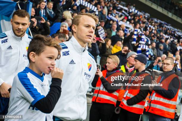 Elliot Kack of Djurgardens IF enters the pitch at the start of an Allsvenskan match between IFK Norrkoping and Djurgardens IF at Nya Parken on...