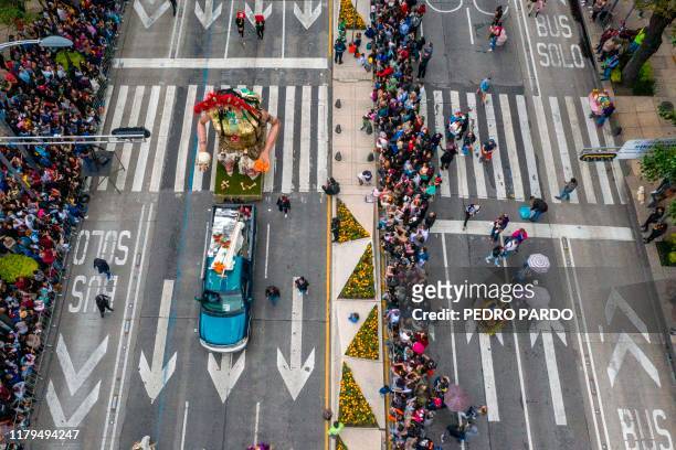 Aerial view of a parade along Reforma Avenue in Mexico City, on November 2 commemorating the Day of the Dead.