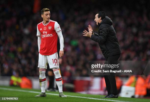 Mesut Ozil of Arsenal and Unai Emery the head coach / manager of Arsenal during the Premier League match between Arsenal FC and Wolverhampton...