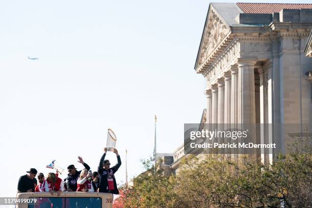 Ryan Zimmerman of the Washington Nationals holds the Commissioner's Trophy during a parade to celebrate the Washington Nationals World Series victory...