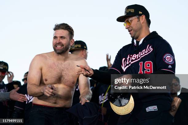 Brian Dozier and Anibal Sanchez of the Washington Nationals celebrate during a parade to celebrate the Washington Nationals World Series victory over...