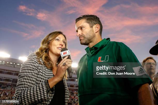 Sideline Reporter Allison Williams interviews Head Coach Manny Diaz of the Miami Hurricanes after the game against the Florida State Seminoles at...