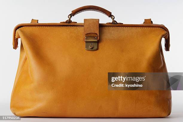 isolated shot of brown leather bag on white background - vintage luggage stock pictures, royalty-free photos & images