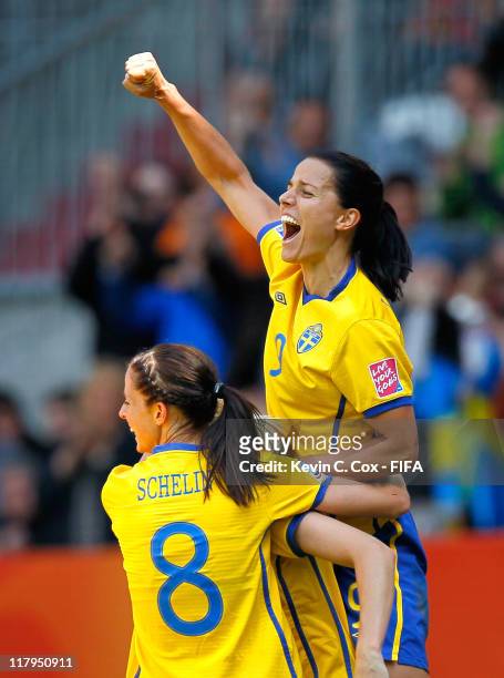 Jessica Landstrom and Lotta Schelin celebrate the first goal by Lisa Dahlkvist of Sweden against Korea DPR during the FIFA Women's World Cup 2011...