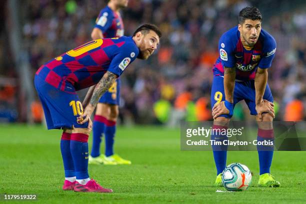 October 6: Lionel Messi of Barcelona and Luis Suarez of Barcelona discuss a free kick on the edge of the box during the Barcelona V Sevilla, La Liga...