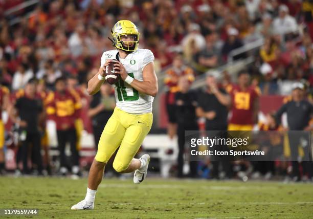 Oregon Justin Herbert rolls out of the pocket during a college football game between the Oregon Ducks and the USC Trojans on November 02 at the Los...