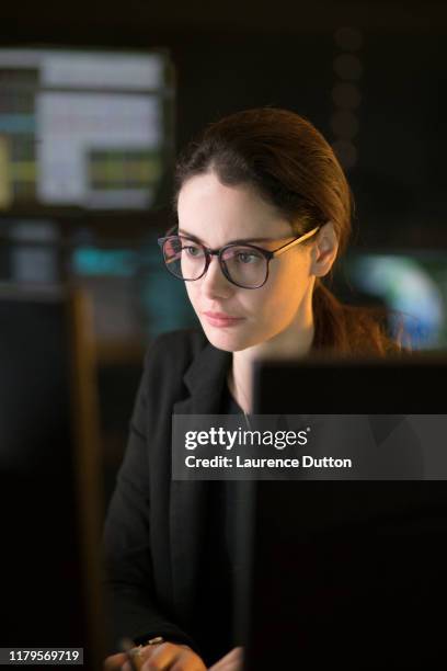 working surrounded by displays - person surrounded by computer screens stock pictures, royalty-free photos & images