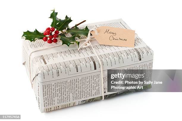 christmas on budget - newspaper wrapped gift stock pictures, royalty-free photos & images