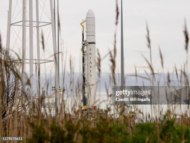 The Northrop Grumman Antares rocket is seen a few hours after arriving at launch Pad-0A, Tuesday, Oct. 29 at NASA's Wallops Flight Facility in...