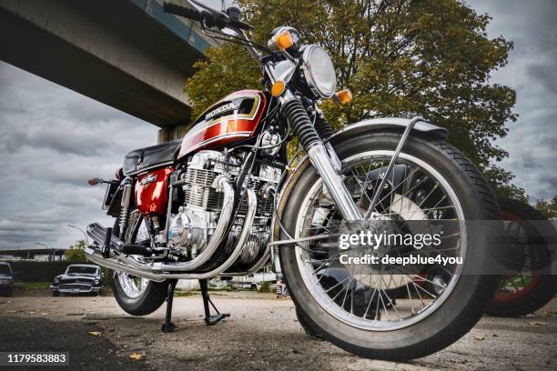 close up of a honda cb 750 vintage motorcycle parked somewhere in hamburg, germany - 4 wheel motorbike stock pictures, royalty-free photos & images
