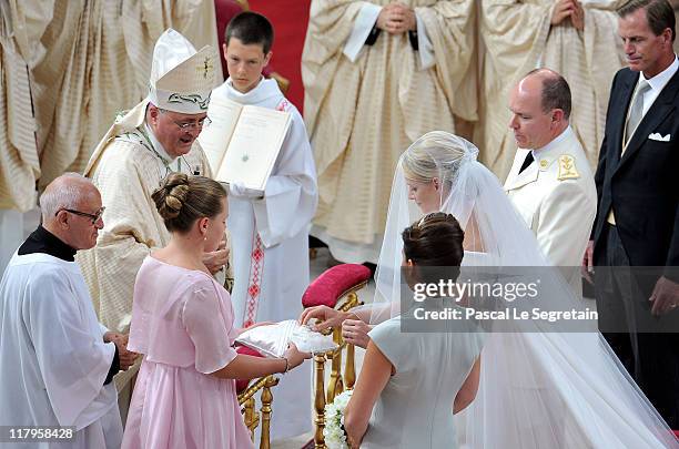 Princess Charlene of Monaco and Prince Albert Of Monaco arrive for the religious ceremony of the Royal Wedding of Prince Albert II of Monaco to...