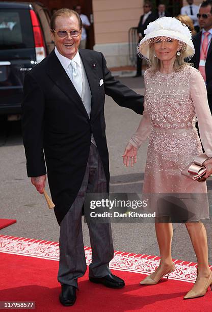 Sir Roger Moore and wife Kristina Tholstrup attend the religious ceremony of the Royal Wedding of Prince Albert II of Monaco to Princess Charlene of...