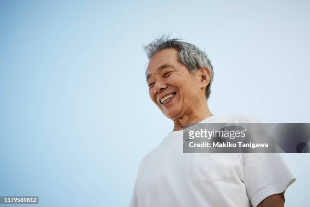 senior man on sunny day - plain t shirt stock pictures, royalty-free photos & images