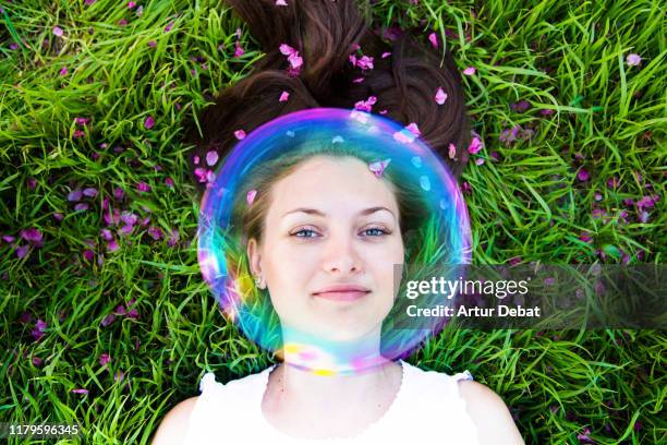 woman protected with invisible bubble against allergies during springtime. - grass pollen stock pictures, royalty-free photos & images