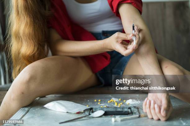 drugs addiction - injecting heroin stock pictures, royalty-free photos & images