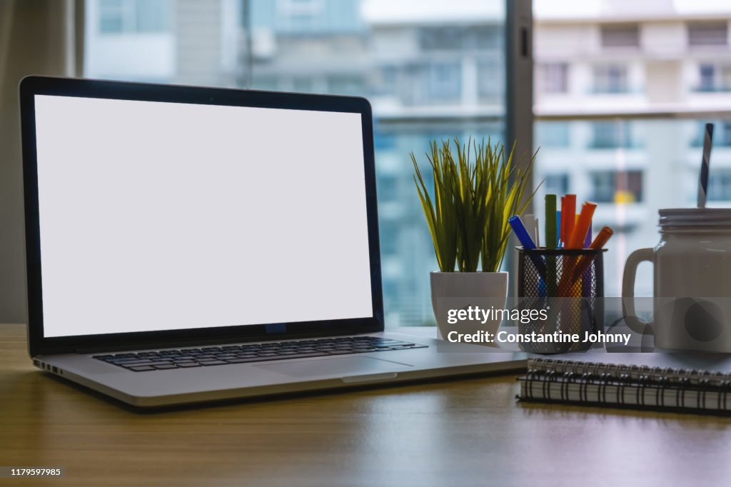 Laptop and Office Supplies on Home Office Desk