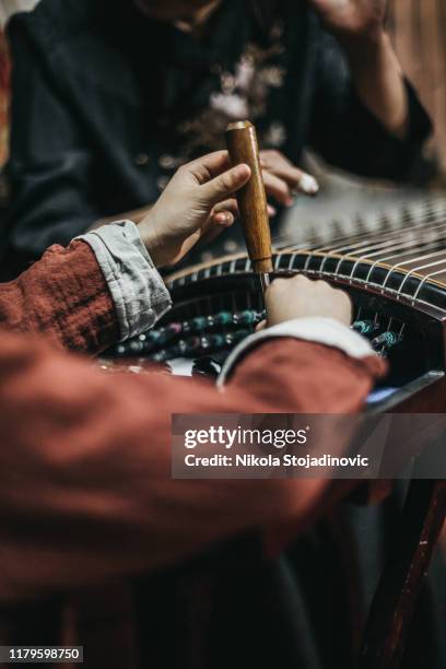 chinese grandmother and grandson and traditional harp - zither stock pictures, royalty-free photos & images