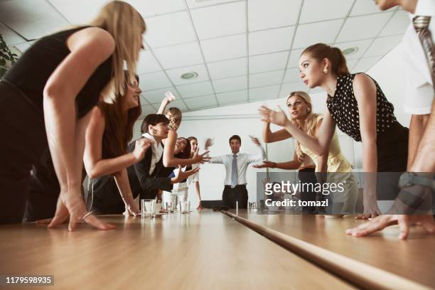 team fighting over a problem - conflict management stock pictures, royalty-free photos & images