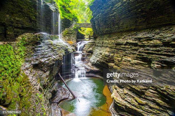 waterfall and bridge at watkins glen state park, new york - state park fotografías e imágenes de stock