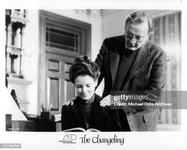 Trish Van Devere researches with George C. Scott about the history of the old Victorian Mansion in a scene from the film 'The Changeling', 1980.