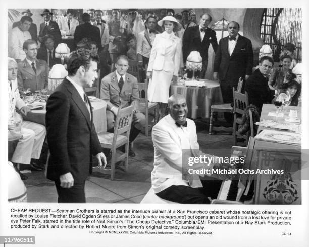 Peter Falk, Louise Fletcher, David Ogden Stiers, and James Coco watch Scatman Crothers play the piano in a scene from the film 'The Cheap Detective',...