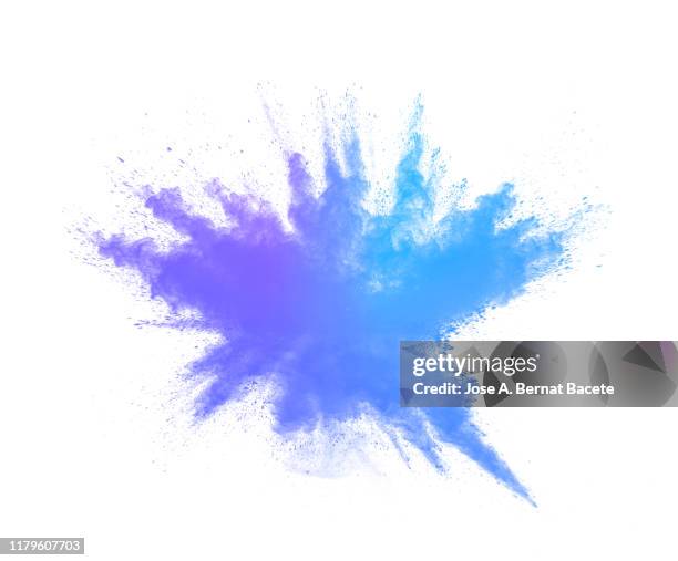 explosion by an impact of a cloud of particles of powder and smoke blue color on a white background. - powder paint stock pictures, royalty-free photos & images