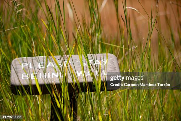 caution: please stay behind wall signal. - keep out sign stock pictures, royalty-free photos & images