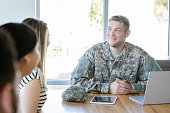 Veteran in meeting with new military recruits