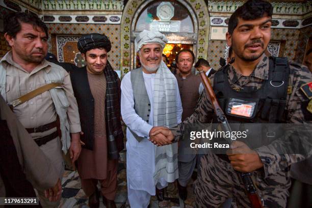 After visiting the mausoleum under construction of General Abdul Raziq, Dr. Abdullah receives from the notables of the city the turban, as a sign of...