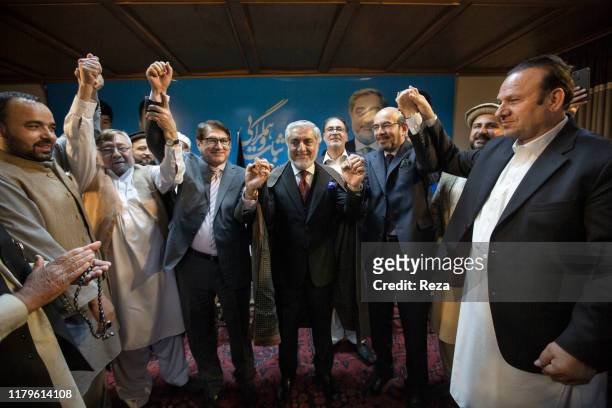 Dr Abdullah receives the support of Mirwais, son of Afghanistan's last king from 1933 to 1973 Zaher Shah, by giving him the "chapan" or "king's hate"...