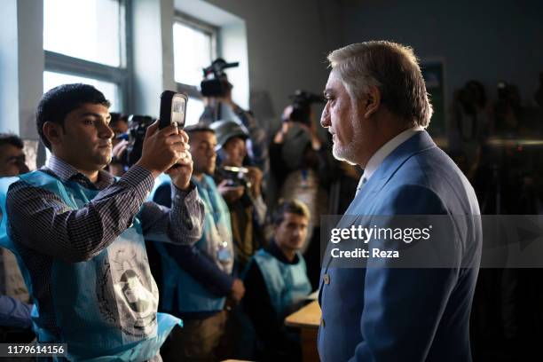 On the voting day, the candidate Dr Abdullah conducts his civil duty by voting under the watch of those present. To do so, he submits himself to the...