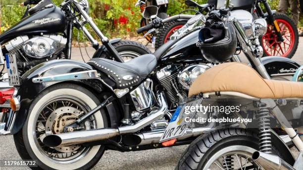close up of parked motorcycles, parked somewhere in hamburg - germany - 4 wheel motorbike stock pictures, royalty-free photos & images