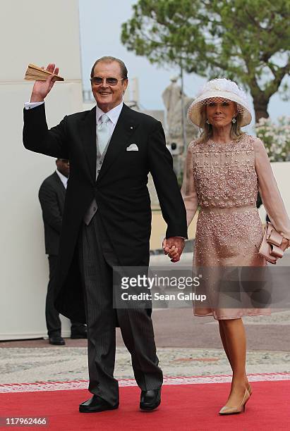 Sir Roger Moore and wife Kristina Tholstrup attend the religious ceremony of the Royal Wedding of Prince Albert II of Monaco to Princess Charlene of...