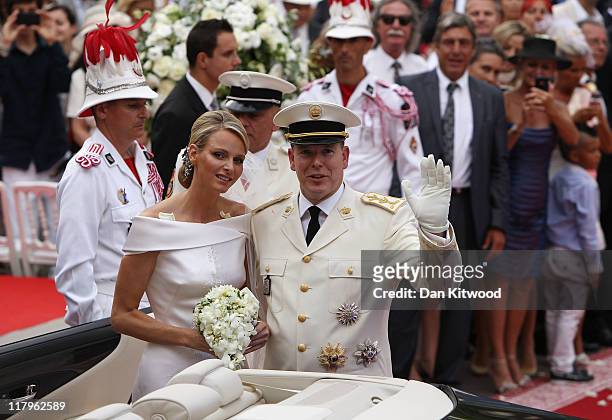 Princess Charlene of Monaco and Prince Albert II of Monaco make their journey to Sainte Devote church after their religious wedding ceremony at the...