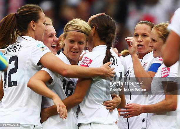 Carli Lloyd of USA celebrates with her team mates after scoring her team's third goal during the FIFA Women's World Cup 2011 Group C match between...