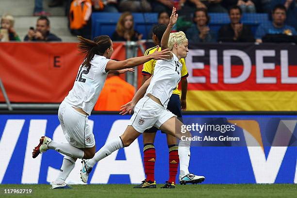 Megan Rapinoe of USA celebrates her team's second goal with team mate Lauren Cheney during the FIFA Women's World Cup 2011 Group C match between USA...