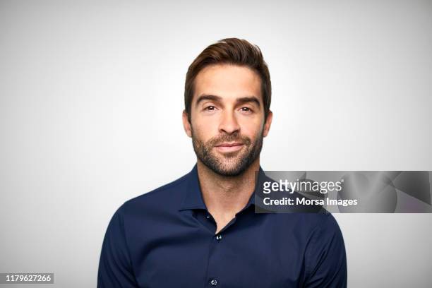 handsome mid adult businessman with stubble - shirt foto e immagini stock