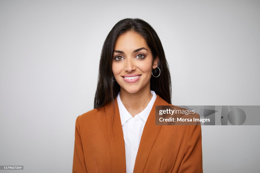 Smiling beautiful female CEO with hazel eyes