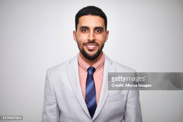 smiling male design professional wearing gray suit - handsome muslim men stock pictures, royalty-free photos & images