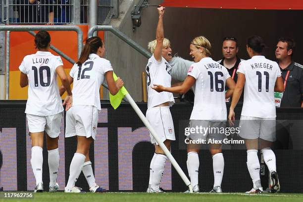 Megan Rapinoe of USA celebrates her team's second goal with team mates during the FIFA Women's World Cup 2011 Group C match between USA and Colombia...