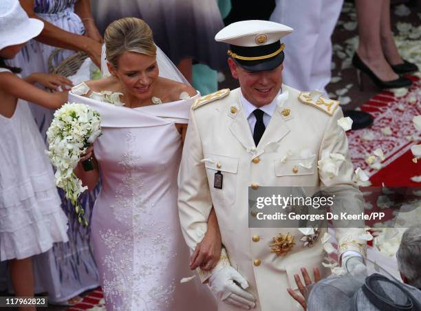 Princess Charlene of Monaco and Prince Albert II of Monaco leave the religious ceremony of the Royal Wedding of Prince Albert II of Monaco to...