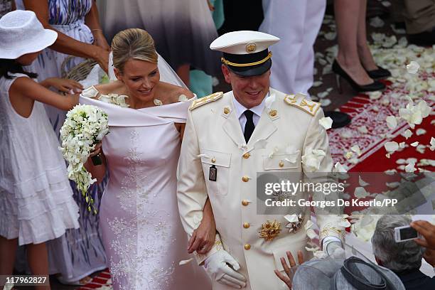 Princess Charlene of Monaco and Prince Albert II of Monaco leave the religious ceremony of the Royal Wedding of Prince Albert II of Monaco to...