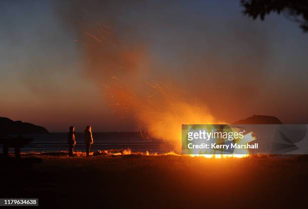 Ahi Kaa are lit along the beaches of Tūranganui-a-Kiwa on October 08, 2019 in Gisborne, New Zealand. This year marks 250 years since the first...