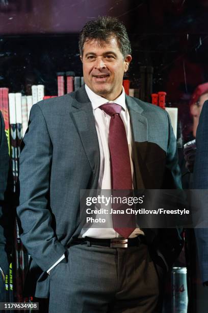 Associate Coach Jack Capuano of the Ottawa Senators looks on from the bench during player introductions prior to their home opener against the New...